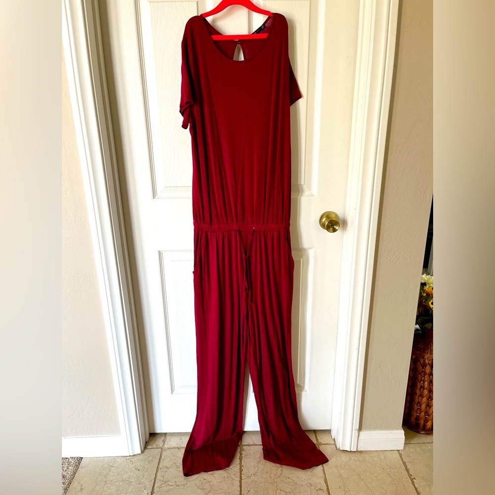Deep red jumpsuit, size M, worn lightly, cutout in back